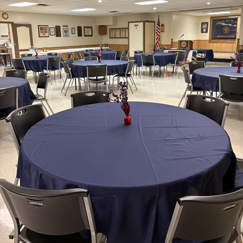 Hall Photo 2 8x8 Inside the Hall at Post 663 with a view of round tables with rich blue table covers.